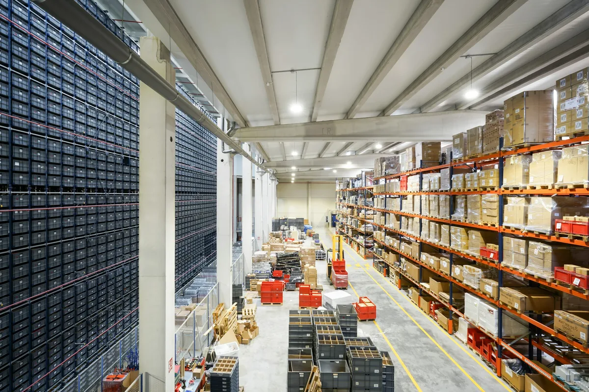 a large warehouse filled with lots of boxes — professional food preparation environment